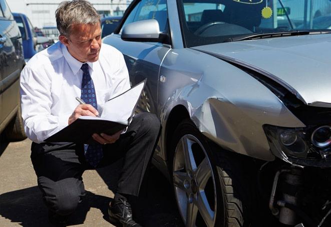 woman reviewing car insurance policy on tablet